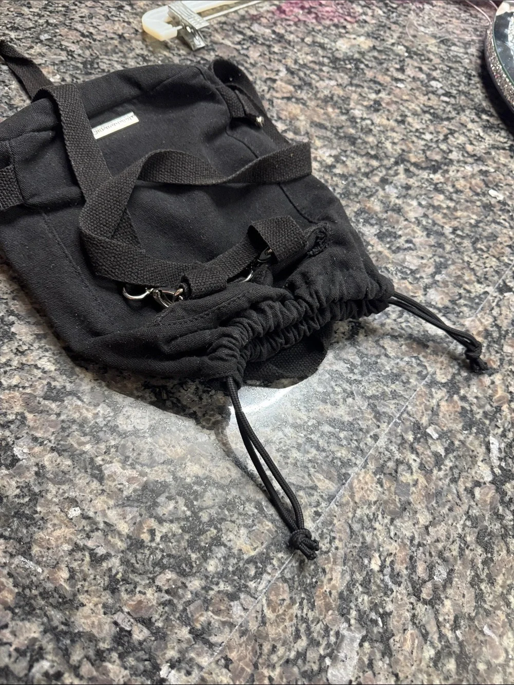 Madden Girl Black Canvas Drawstring Backpack with Front Zip Pocket